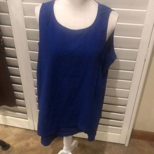 Chico’s blue sleeveless 100% cotton top. Interesting diagonal hem.